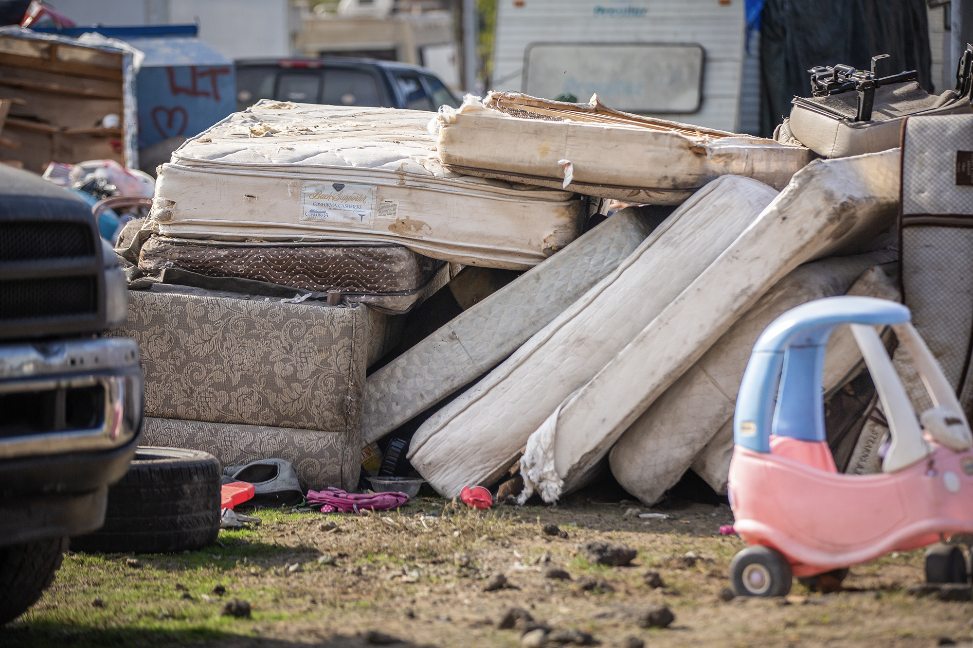 Mattresses lay on top of each other in a makeshift playground at Stockton Park Village in Stockton on Nov. 22, 2022. Bobby Riley, 87, lives in the area where he states that the owner let the park go and garbage hasn't been picked up for months.